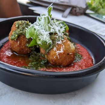 Olive & Ivy signature dishes Pacific Sea BassBacon Wrapped DatesLamb Meatballs